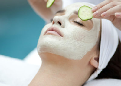 Exfoliating cream and cucumber facial treatment