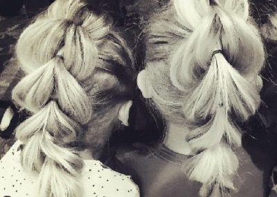 Young girls with braided hair for wedding preparations